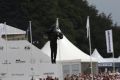 The JB11 jetpack flies over the crowds in front of Goodwood house (Photo by Marc Waller)